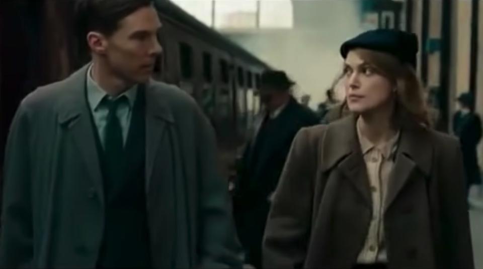 Benedict Cumberbatch and Kiera Knightly in "The Imitation Game" walking next to a train