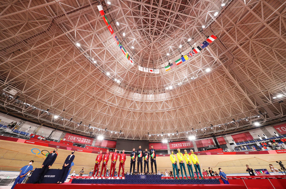 <p>IZU, JAPAN - AUGUST 04: (L-R) A general view of Silver medalist Lasse Norman Hansen, Niklas Larsen, Frederik Madsen and Rasmus Pedersen of Team Denmark, gold medalist Simone Consonni, Filippo Ganna, Francesco Lamon and Jonathan Milan of Team Italy, and bronze medalist Leigh Howard, Kelland O'Brien, Lucas Plapp and Sam Welsford of Team Australia, as they pose on the podium during the medal ceremony after the Men's team pursuit finals of the track cycling on day twelve of the Tokyo 2020 Olympic Games at Izu Velodrome on August 04, 2021 in Izu, Japan. (Photo by Justin Setterfield/Getty Images)</p> 