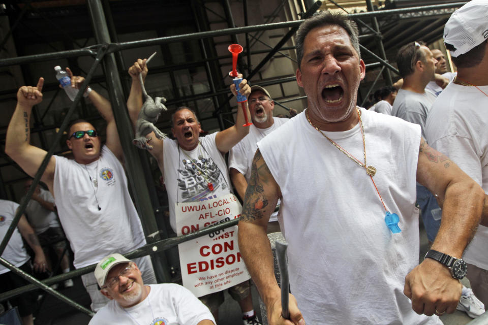 Members of the Utility Workers Union of America Local 1-2 participate in a march and rally in support of locked out Consolidated Edison workers, Tuesday, July 17, 2012 at Union Square in New York. The Con Ed workers were locked out on June 30 after their contract expired and negotiations over a new one failed. About 5,000 managers are keeping electricity going for 3.2 million customers in New York City and Westchester County. (AP Photo/Mary Altaffer)