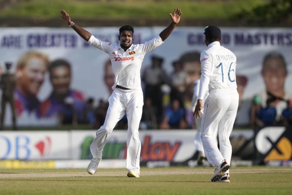 Sri Lanka's Ramesh Mendis celebrates the wicket of Australia's Cameron Green during the day two of the first test cricket match between Australia and Sri Lanka in Galle, Sri Lanka, Thursday, June 30, 2022. (AP Photo/Eranga Jayawardena)