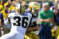 Purdue linebacker Jaylan Alexander (36) sacks Notre Dame quarterback Jack Coan (17) during the first half of an NCAA college football game in South Bend, Ind., Saturday, Sept. 18, 2021. (AP Photo/Michael Conroy)