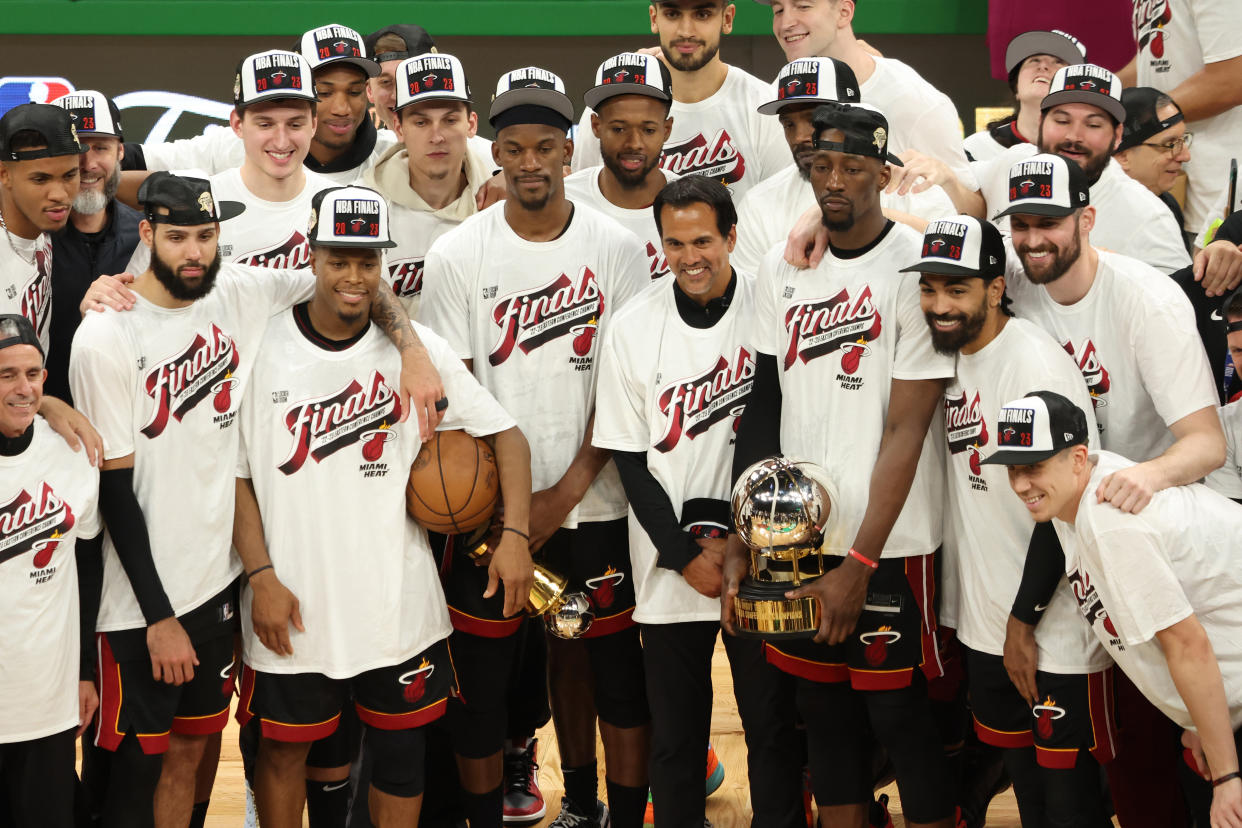 The Miami Heat pose with the Bob Cousy Trophy after defeating the Boston Celtics in the Eastern Conference finals on May 29, 2023 in Boston. (Adam Glanzman/Getty Images)