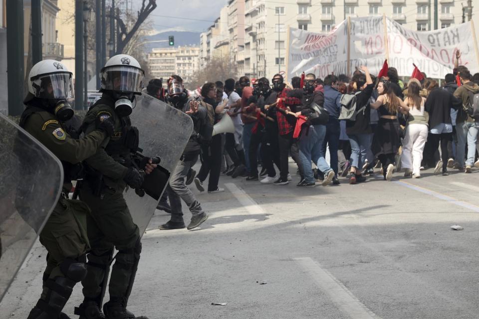 Riot police operate against demonstrators during clashes in Athens, Greece, Sunday, March 5, 2023. Thousands protesters, take part in rallies around the country for fifth day, protesting the conditions that led the deaths of dozens of people late Tuesday, in Greece's worst recorded rail accident. (AP Photo/Yorgos Karahalis)