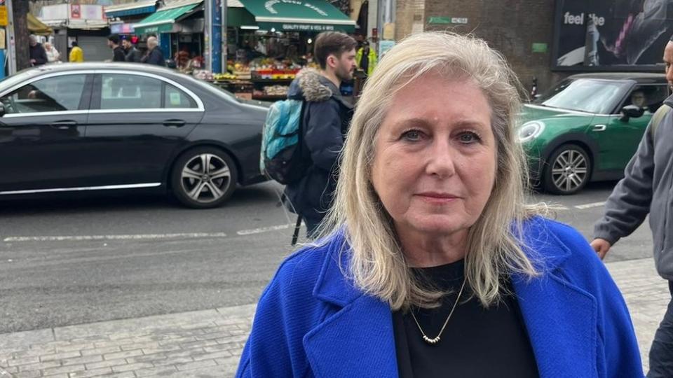 Susan Hall, wearing a blue jacket, stood outside Shepherd's Bush Market