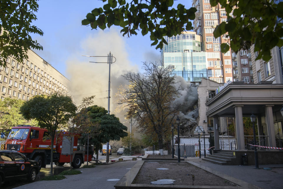 Firefighters work to put out a fire in a residential building destroyed by a Russian drones strike in Kyiv, Ukraine October 17, 2022 (Photo by Maxym Marusenko/NurPhoto via Getty Images)