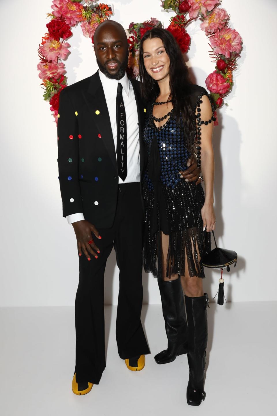 <div class="inline-image__caption"><p>Virgil Abloh and Bella Hadid attend the Louis Vuitton Parfum Dinner in Paris in July 2021. </p></div> <div class="inline-image__credit">JULIEN HEKIMIAN</div>