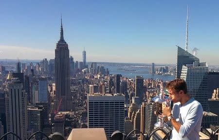 Stan Wawrinka of Switzerland, winner of the 2016 U.S. Open tennis tournament poses with the trophy in Manhattan, New York, U.S., September 12, 2016. REUTERS/Tony Pyle