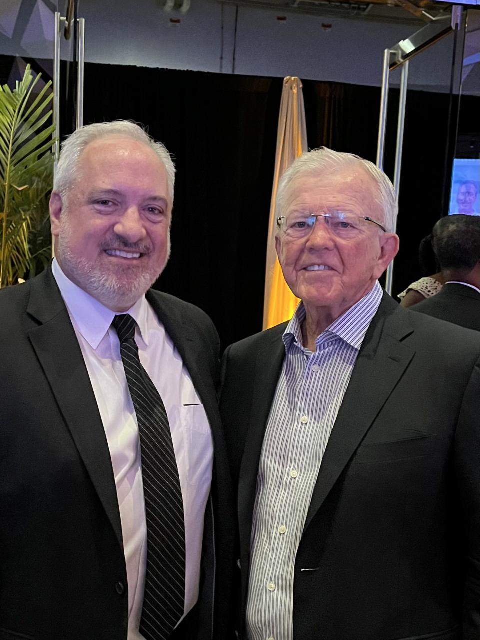 Brett Jewkes, left, and NFL and NASCAR legend Joe Gibbs. | Courtesy NASCAR