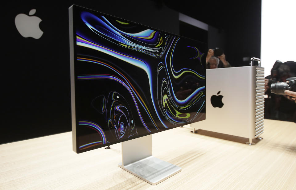 FILE - In this June 3, 2019, file photo a monitor of the Mac Pro is shown in the display room at the Apple Worldwide Developers Conference in San Jose, Calif. On Friday, June 28, The Wall Street Journal reported that Apple will manufacture its new Mac Pro computer in China, shifting away from a U.S. assembly line it had been using for that product in recent years. (AP Photo/Jeff Chiu, File)