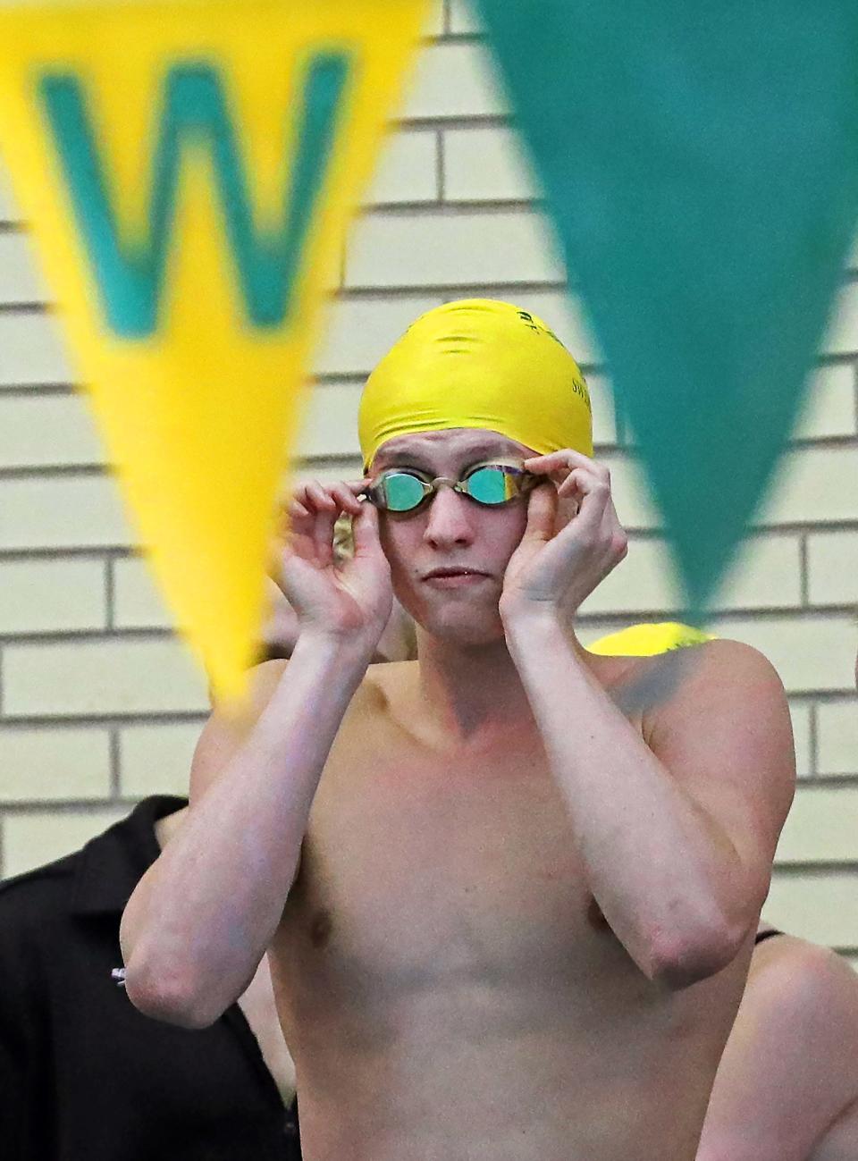 Firestone senior Jonny Marshall gets ready before the boys 200 yard freestyle during a meet Jan. 24 at Firestone High School.