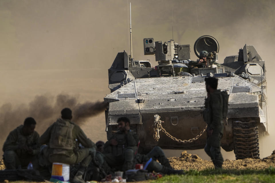 An Israeli APC maneuvers near the Gaza Strip border, in southern Israel, Friday, Dec. 29, 2023. The army is battling Palestinian militants across Gaza in the war ignited by Hamas' Oct. 7 attack into Israel. (AP Photo/Ariel Schalit)