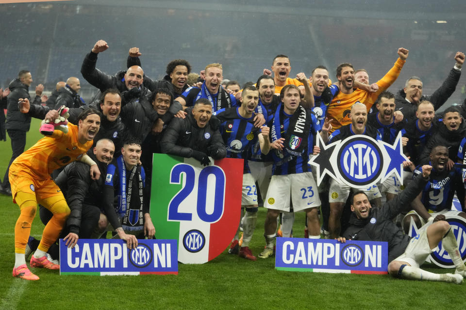 Inter Milan players celebrate at the end of the Serie A soccer match between AC Milan and Inter Milan at the San Siro stadium in Milan, Italy, Monday, April 22, 2024. (AP Photo/Luca Bruno)