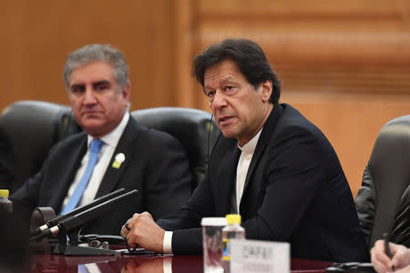 FILE PHOTO: Pakistan's Prime Minister Imran Khan speaks during a meeting with China's President Xi Jinping (not pictured) at the Great Hall of the People in Beijing, China April 28, 2019. Madoka Ikegami/Pool via REUTERS/File Photo