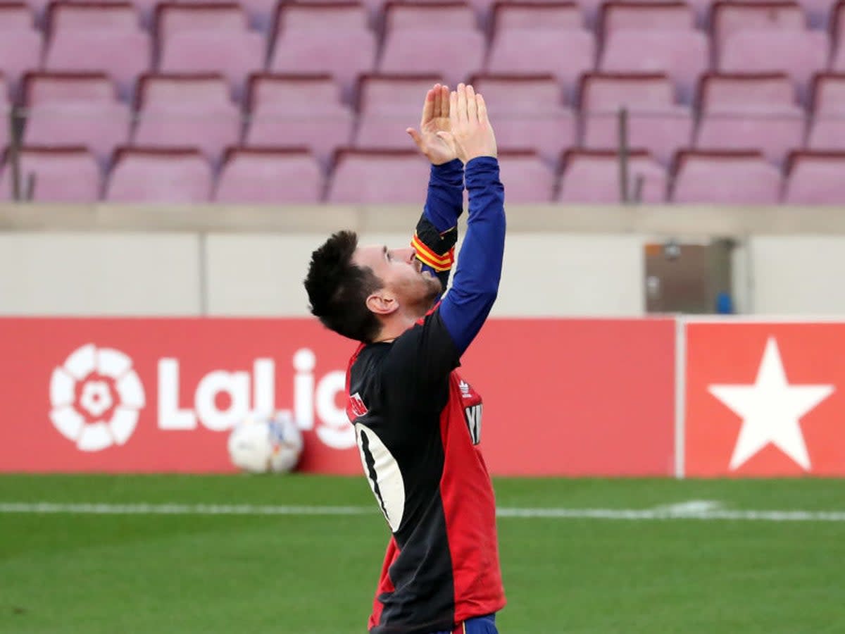 Lionel Messi donned a Newell’s Old Boy shirt to pay tribute to Diego Maradona in 2020  (AFP)