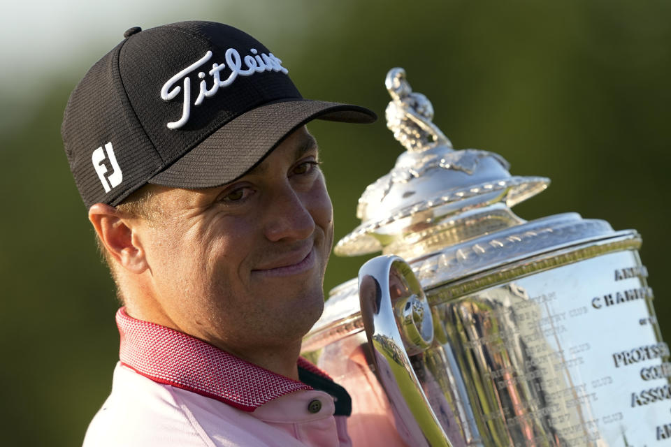 Justin Thomas poses with the Wanamaker Trophy after winning the PGA Championship golf tournament in a playoff against Will Zalatoris at Southern Hills Country Club, Sunday, May 22, 2022, in Tulsa, Okla. (AP Photo/Matt York)