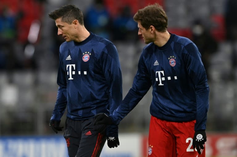 Mueller (R) admits the loss of top-scorer Lewandowski (L) to injury is 'bad timing' for the club world champions