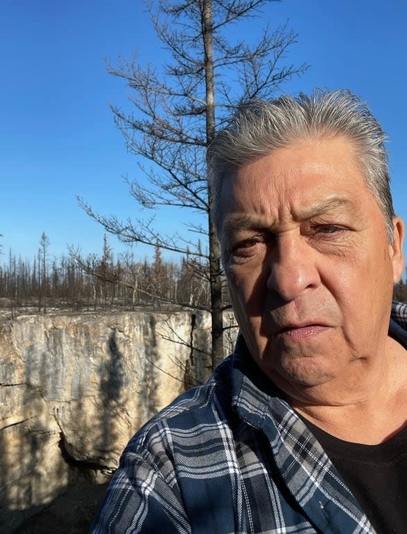 Earl Evans, seen in this photo from last fall in Enterprise, N.W.T., says he's worried about future access to the land for young people after seeing the devastating effects of wildfire on Fort Smith.