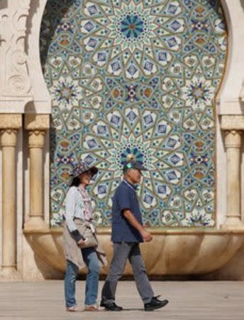 Chinese tourists walks on the esplanade of the Hassan II Mosque in Casablanca, October 6, 2016. REUTERS/Youssef Boudlal