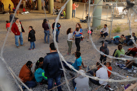 Migrants from Central America wait inside of an enclosure, where they are being held by U.S. Customs and Border Protection (CBP), after crossing the border between Mexico and the United States illegally and turning themselves in to request asylum, in El Paso, Texas, U.S., March 29, 2019. REUTERS/Lucas Jackson