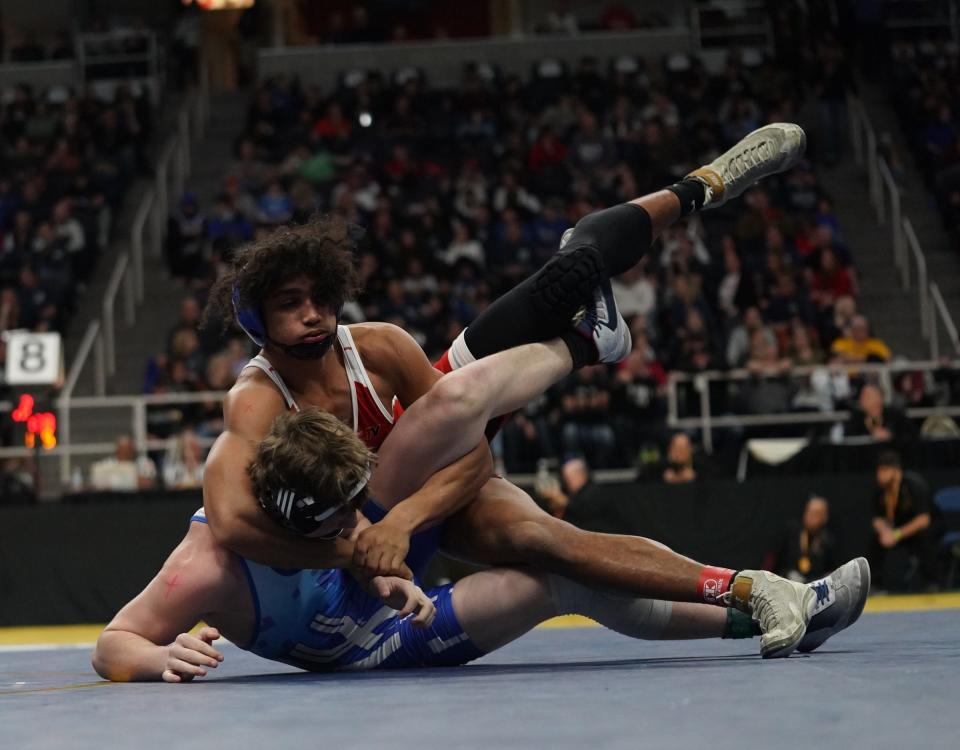 Tioga's Ousmane Duncanson wrestles Saugerties' Christian Hockx in the second round matches of the NYSPHSAA Wrestling Championships at MVP Arena in Albany, on Friday, February 24, 2023.