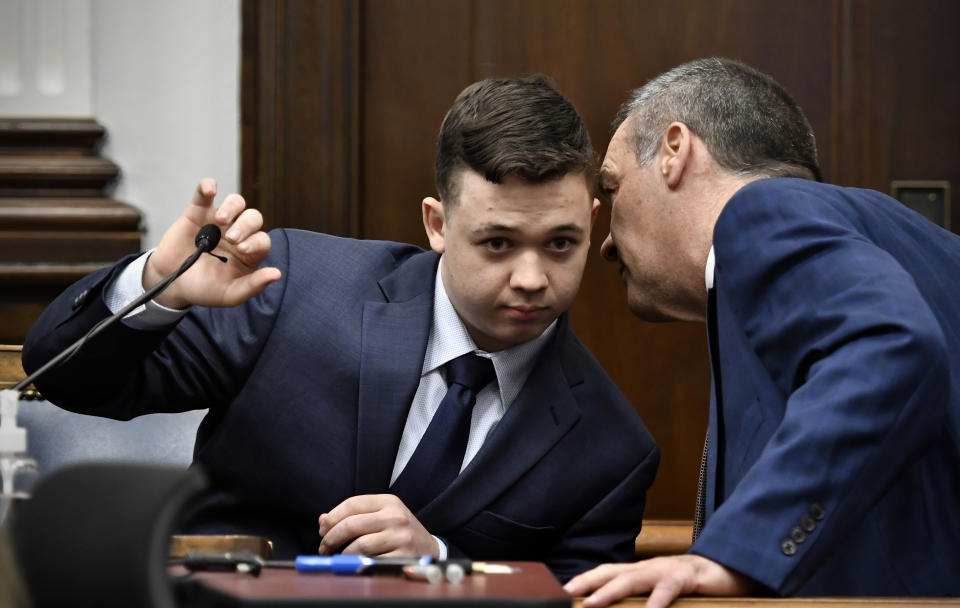 Kyle Rittenhouse, left, listens to his attorney, Mark Richards, as he takes the stand during his trial at the Kenosha County Courthouse in Kenosha, Wis., on Wednesday, Nov. 10, 2021. Rittenhouse is accused of killing two people and wounding a third during a protest over police brutality in Kenosha, last year. (Sean Krajacic/The Kenosha News via AP, Pool)