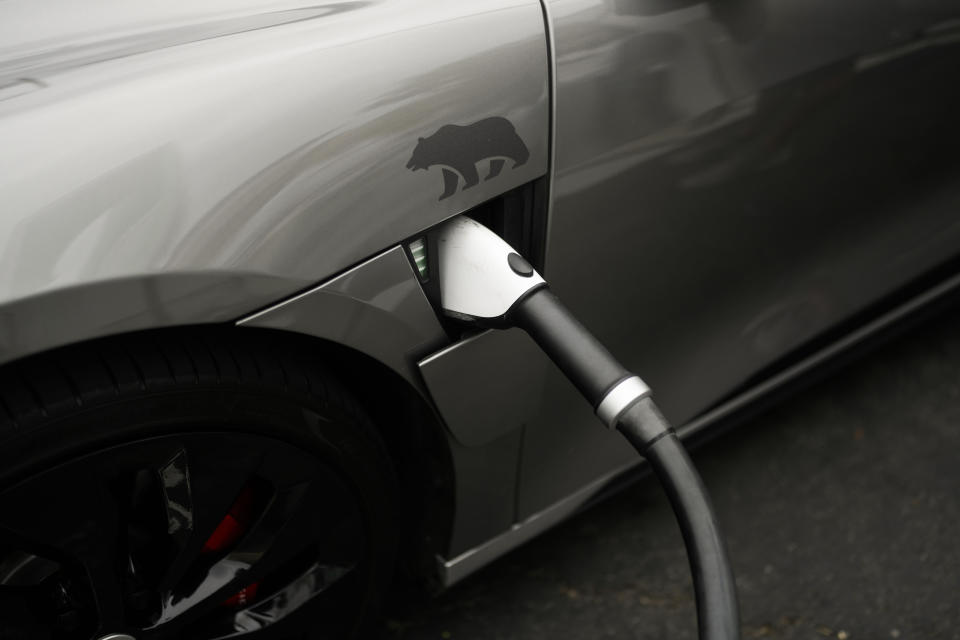 A Combined Charging System (CCS) connector is plugged into an electric vehicle at a charging station in Anaheim, Calif., Friday, June 9, 2023. Currently in the U.S. there mainly are two types of EV charging plugs, Tesla's North American Charging Standard, and CCS1, which is now used by nearly all other automakers but Tesla. (AP Photo/Jae C. Hong)
