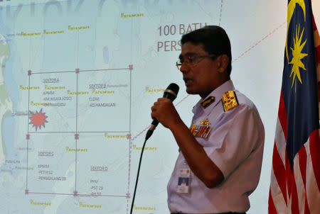 Malaysia Maritime Enforcement Agency (MMEA) officer shows the area of the search and rescue operations for missing personnel of USS John McCain in Putrajaya, Malaysia August 21, 2017. REUTERS/Edgar Su