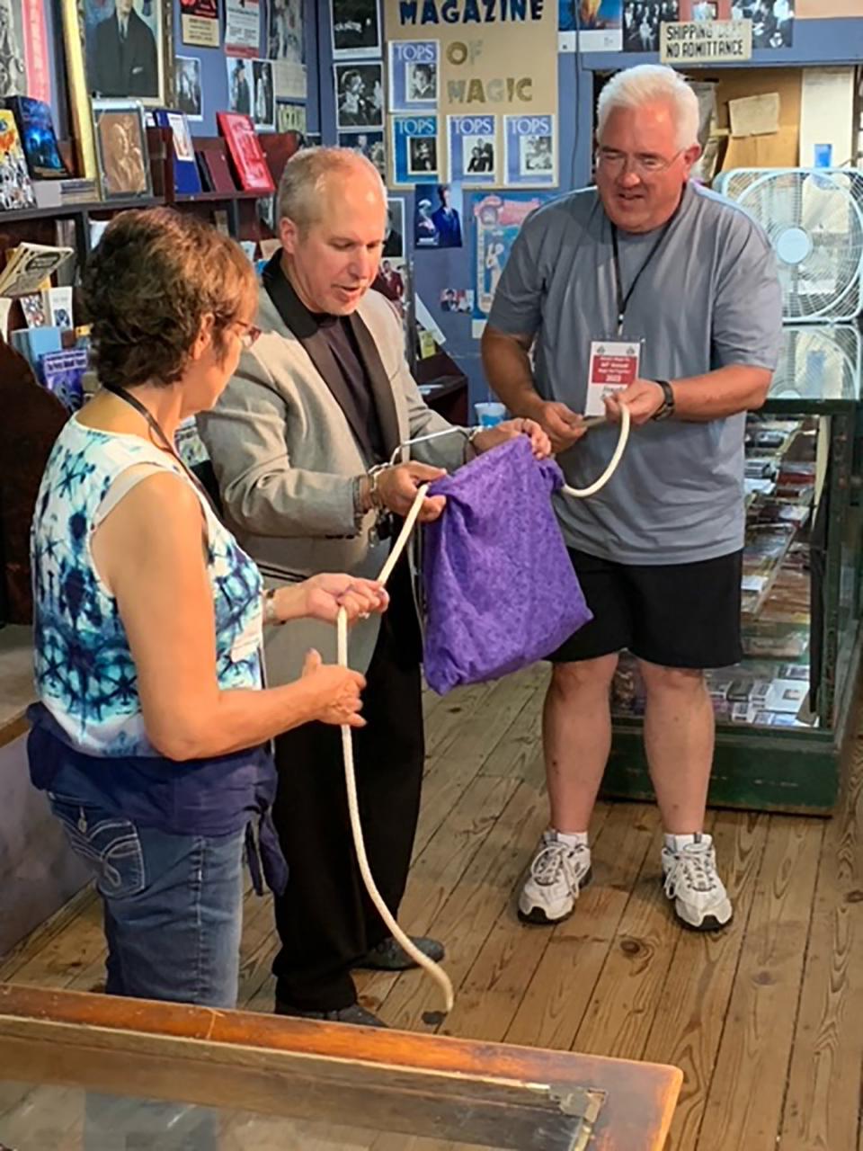 Patty and Frank Gayda assisted magician John Shango with a handcuff trick Wednesday at Abbott's Magic. The 84th Abbott's Magic Get-Together opened Wednesday and concludes Saturday in Colon.