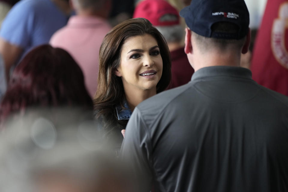 Florida first lady Case DeSantis talks with audience members at U.S. Rep. Zach Nunn's Annual BBQ, Saturday, July 15, 2023, in Ankeny, Iowa. (AP Photo/Charlie Neibergall)