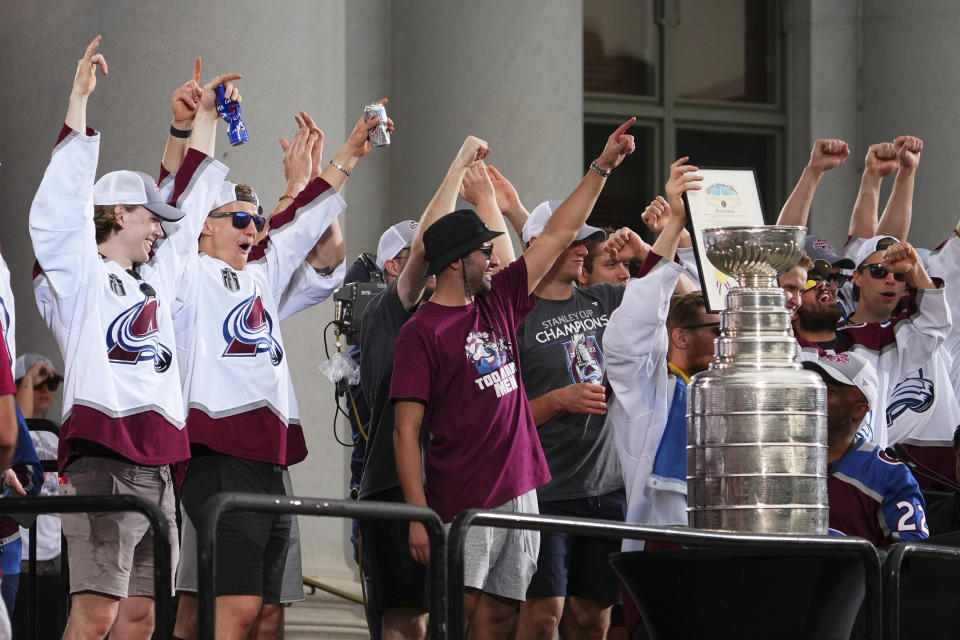 Members of the Colorado Avalanche cheer during a Stanley Cup hockey champions rally Thursday, June 30, 2022, in Denver. (AP Photo/Jack Dempsey)