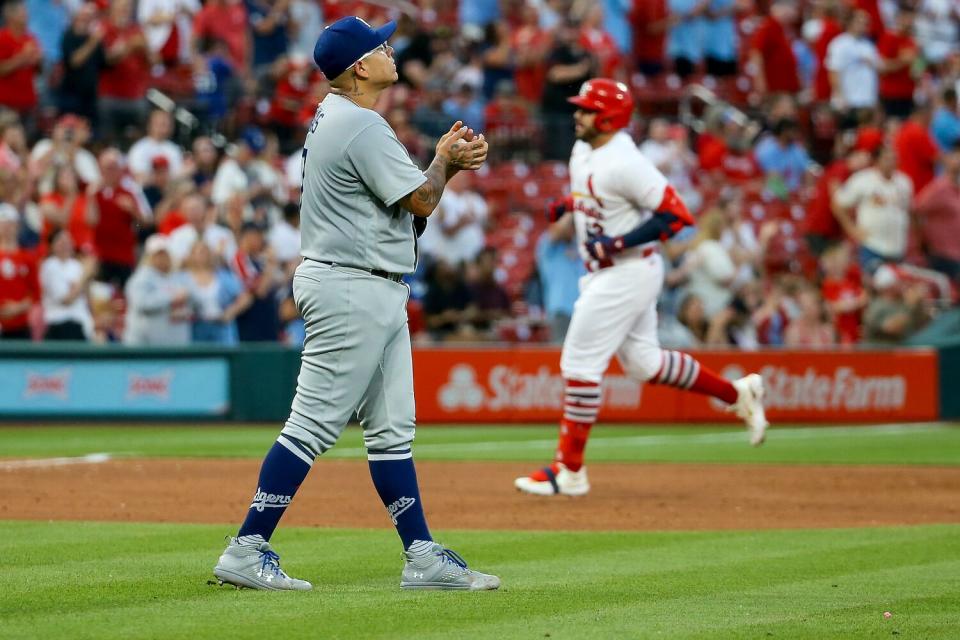 Dodgers pitcher Julio Ur&#xed;as walks back to the mound after giving up a solo home run to Juan Yepez.