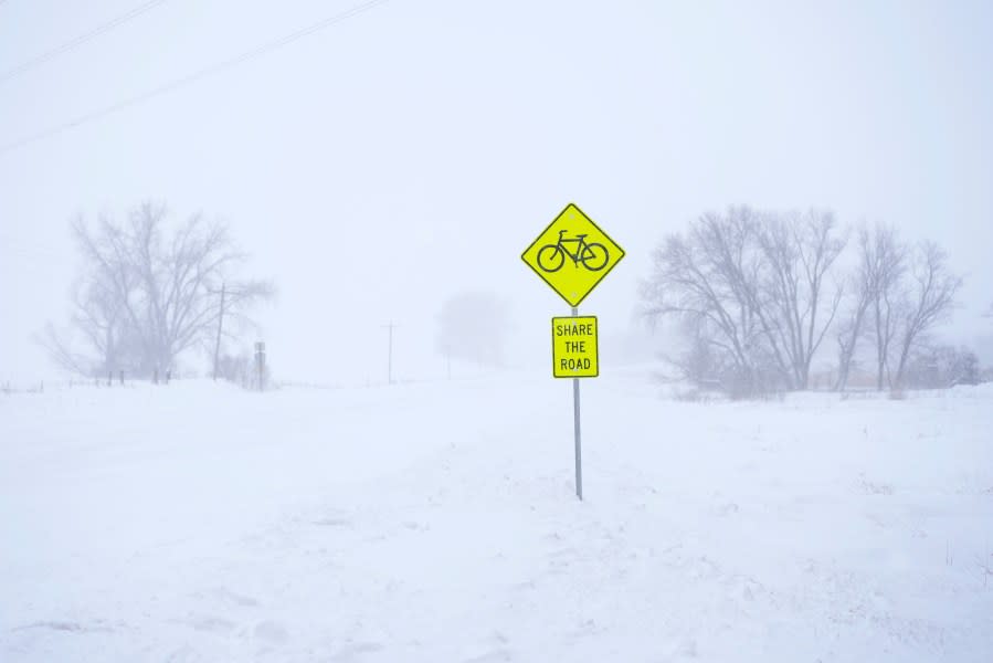 A sign is posted along snow-covered County Road K22 near Merrill, Iowa, on Friday, Jan. 12, 2024. (AP Photo/Carolyn Kaster)