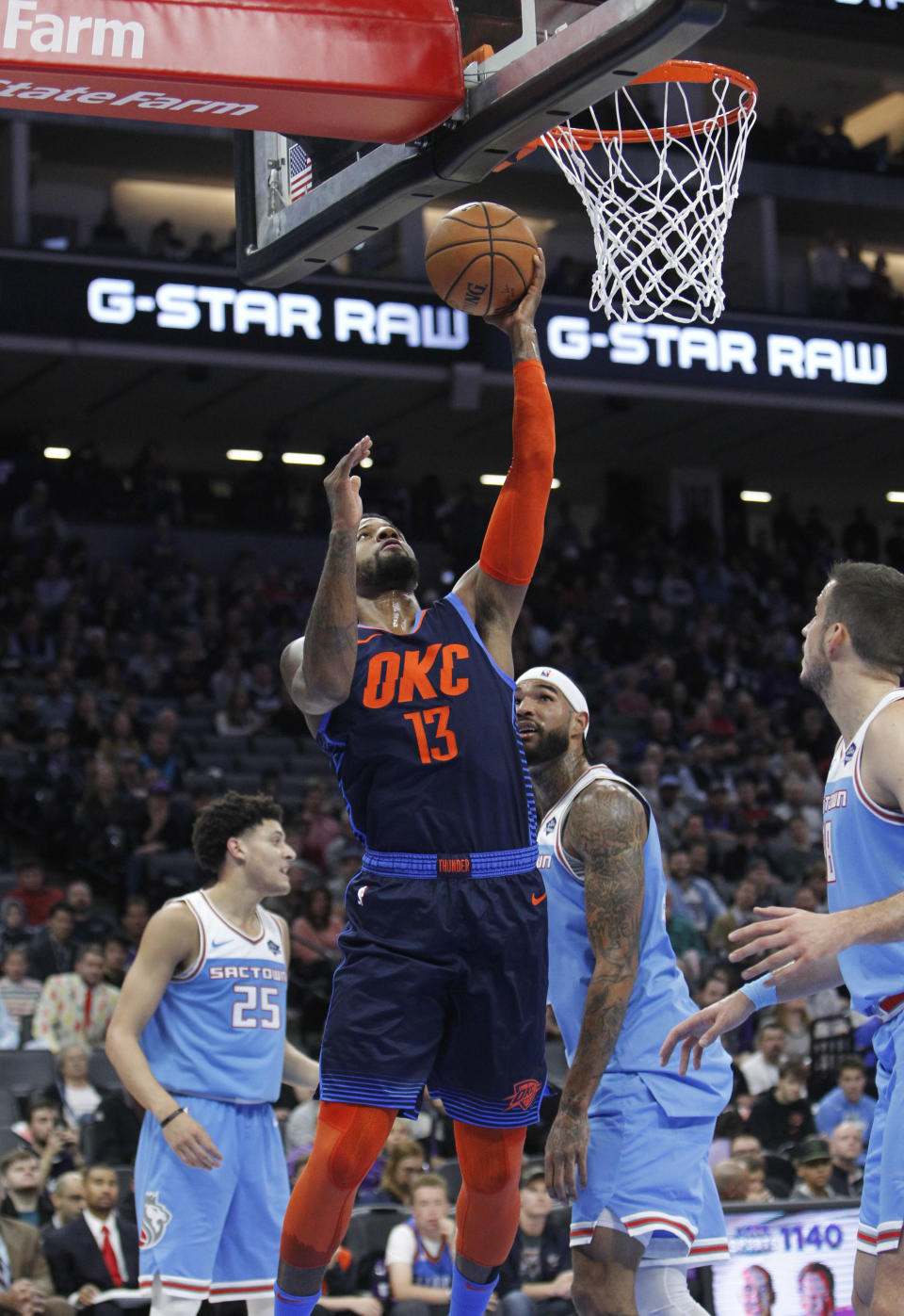 Oklahoma City Thunder forward Paul George (13) breaks away for a basket against the Sacramento Kings during the first half of an NBA basketball game in Sacramento, Calif., Wednesday, Dec. 19, 2018. (AP Photo/Steve Yeater)