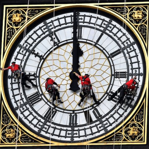 Technicians cleaning Big Ben in 2014 - Credit:  BEN STANSALL/AFP