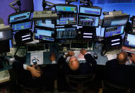 <p>Financial professionals work at stations on the floor of the New York Stock Exchange in the middle of the trading day May 20, 2010 in New York City. Stocks dropped today over concerns that debt involved with Europe’s bailout plan could slow a global recovery. (Photo by Chris Hondros/Getty Images) </p>
