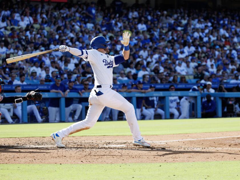 Gavin Lux hits a solo home run in the fourth inning of the Dodgers' win over the Red Sox on Sunday.