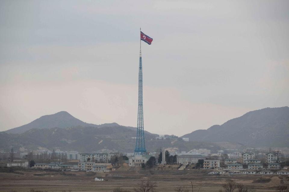 North Korean national flag in North Korea's propaganda village of Gijungdong seen from the DMZ