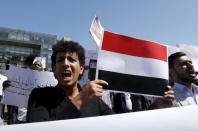 Arab students shout slogans, and carry banners and a Yemeni national flag during a protest against Saudi-led air strikes on Yemen, in front of the offices of the U.N. headquarters in Beirut April 1, 2015. REUTERS/Mohamed Azakir