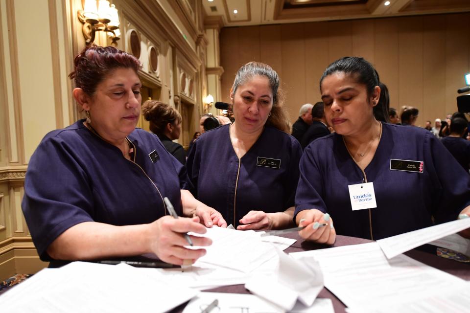 Bellagio hotel workers check in before caucusing at the Bellagio Hotel in Las Vegas, Nevada, on Saturday.