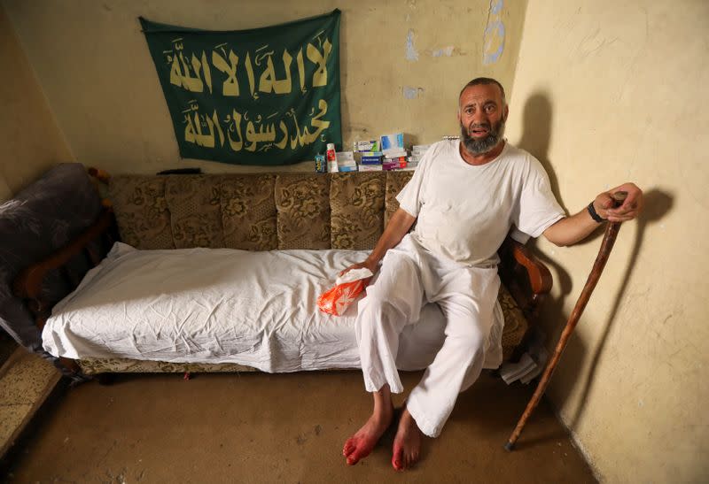 Amer al-Dahn speaks during an interview with Reuters at his home in Tripoli