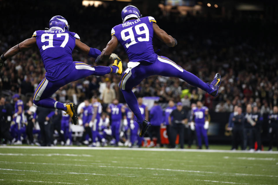 Minnesota Vikings defensive end Everson Griffen (97) and Minnesota Vikings defensive end Danielle Hunter (99) celebrate a sack in the first half of an NFL wild-card playoff football game against the New Orleans Saints, Sunday, Jan. 5, 2020, in New Orleans. (AP Photo/Butch Dill)