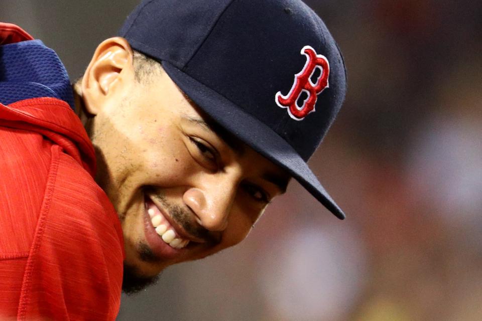 Mookie Betts flashed a smile just like this one after he was done rolling a perfect game at the World Series of Bowling. (Getty Images)