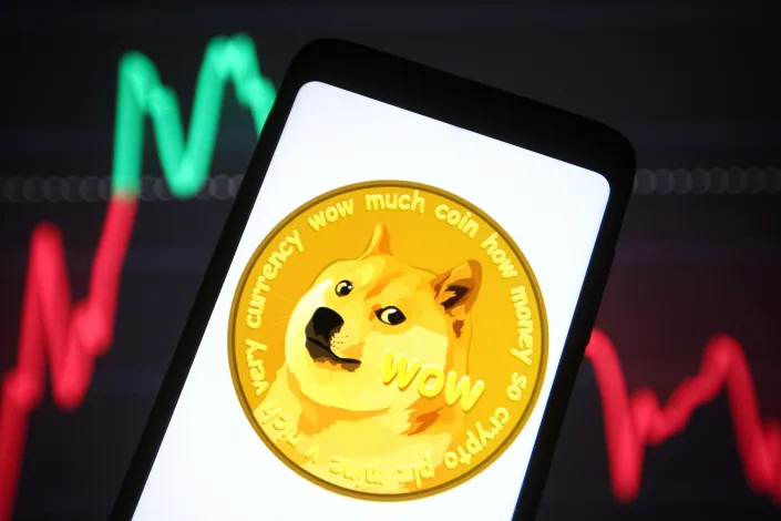 UKRAINE - 2021/11/23: In this photo illustration, a Dogecoin sign of a cryptocurrency is seen on a smartphone screen. (Photo Illustration by Pavlo Gonchar/SOPA Images/LightRocket via Getty Images)