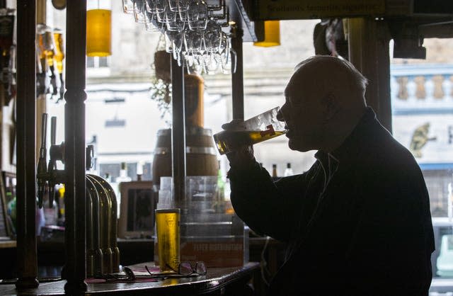 Man drinking pint