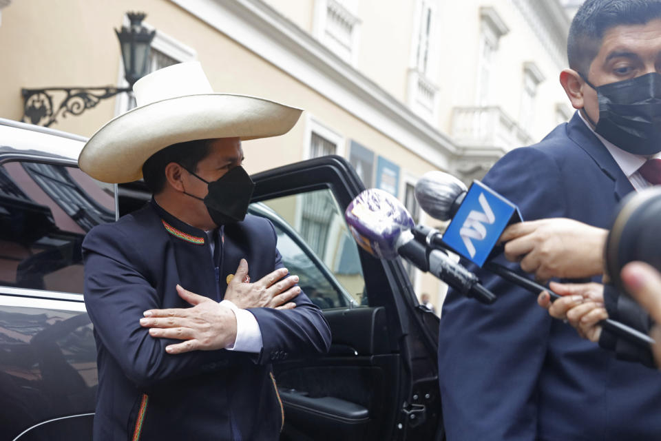 President-elect Pedro Castillo gestures as he arrives to the Foreign Ministry before going to Congress for his swearing-in ceremony on his Inauguration Day in Lima, Peru, Wednesday, July 28, 2021. (AP Photo/Guadalupe Pardo)