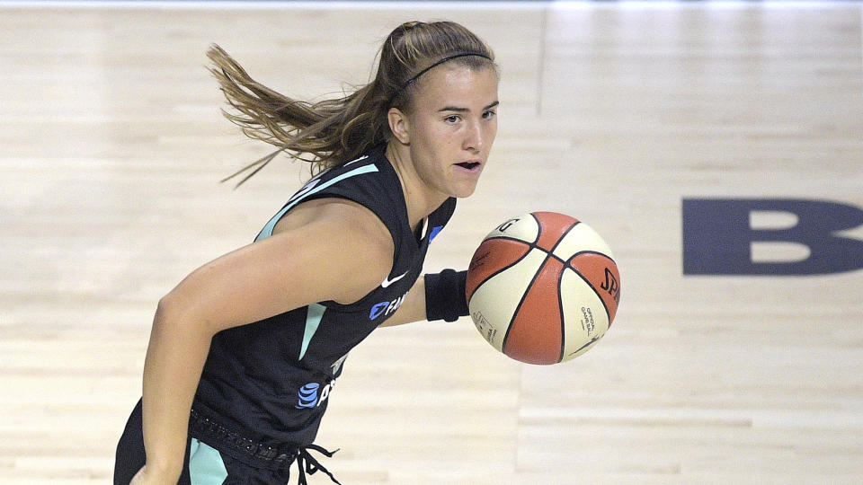 Sabrina Ionescu with ball on the court.