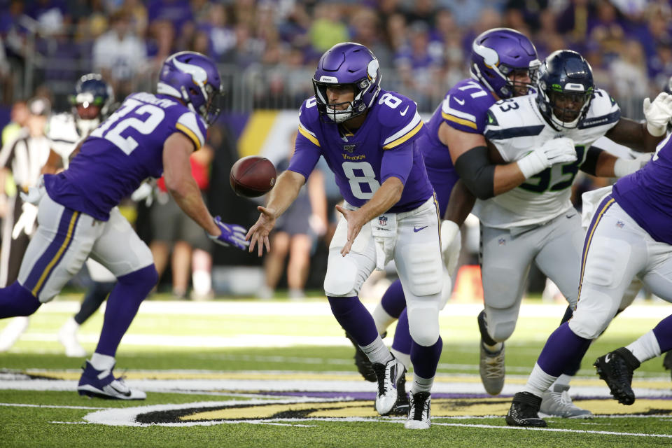 Minnesota Vikings quarterback Kirk Cousins (8) pitches the ball during the first half of an NFL preseason football game against the Seattle Seahawks, Sunday, Aug. 18, 2019, in Minneapolis. (AP Photo/Bruce Kluckhohn)