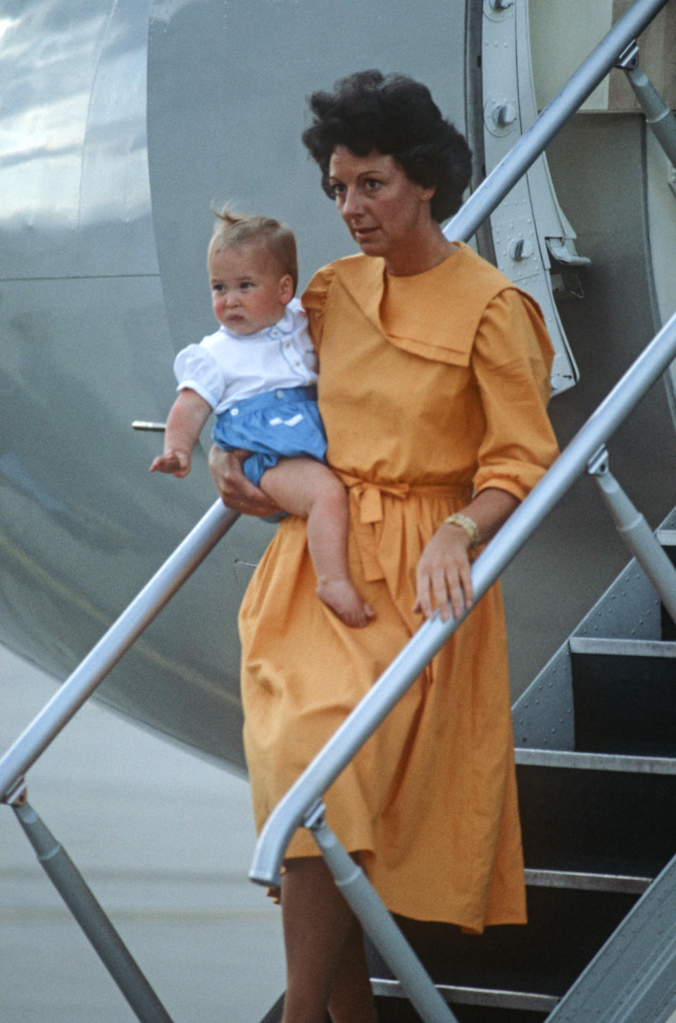 MELBOURNE - APRIL 16: Nanny Barbara Barnes carries Prince William off of a plane at Melbourne Airport, Australia on April 16, 1983, at the end of the Royal Tour of Australia.(Photo by David Levenson/Getty Images)