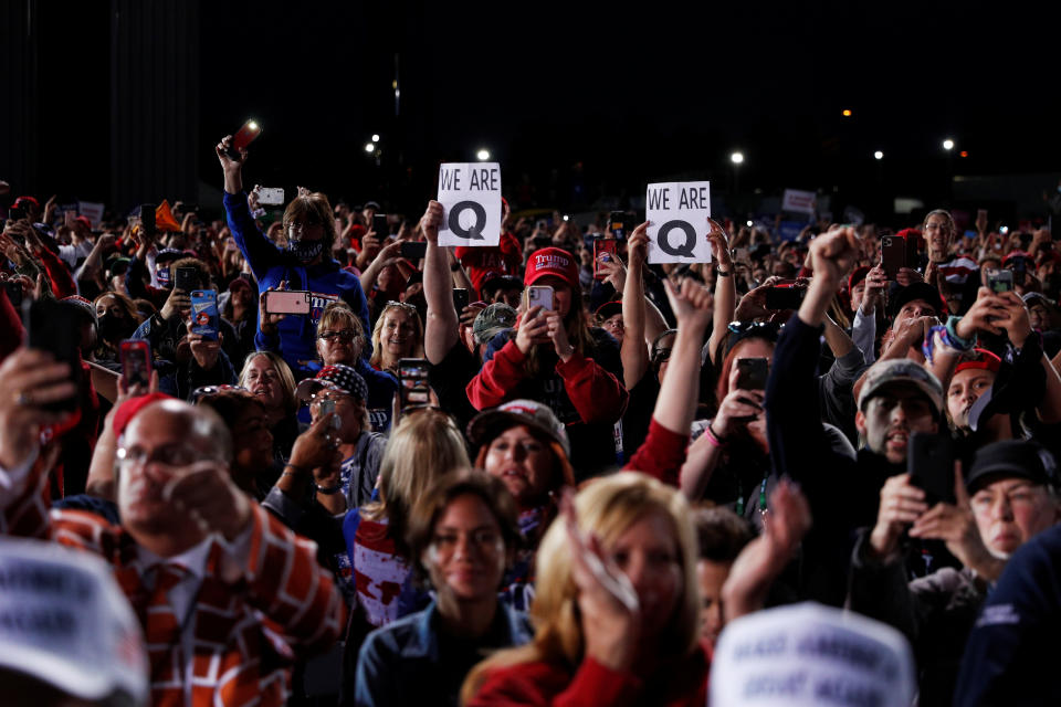 People holding QAnon signs attend a campaign rally with U.S. President Donald Trump in Moon Township, Pennsylvania, U.S., September 22, 2020. REUTERS/Tom Brenner