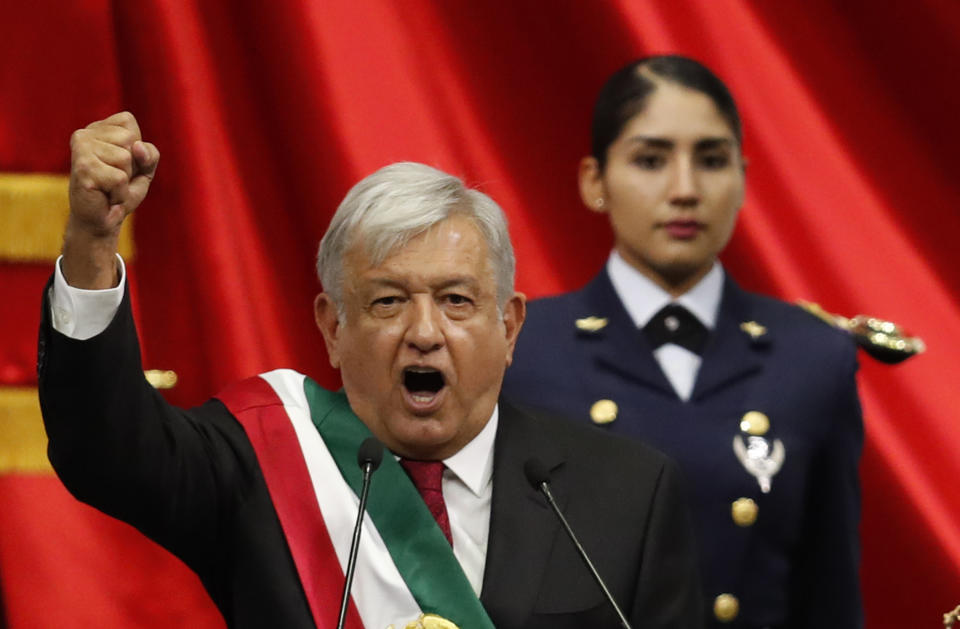 FILE - Mexican President Andres Manuel Lopez Obrador addresses the nation on his inauguration day at Congress in Mexico City, Dec. 1, 2018. Lopez Obrador swept into office with the motto laying out his administration’s priorities: “For the good of all, first the poor.” (AP Photo/Eduardo Verdugo, File)